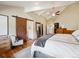 Spacious main bedroom featuring vaulted ceilings, wood floors, ensuite bathroom, and a walk-in closet at 24172 Jerome Ct, Golden, CO 80401