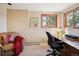 Home office with bright natural light and a comfortable seating area at 24172 Jerome Ct, Golden, CO 80401