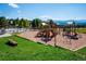 Community playground with slides and play equipment alongside a pool at 24172 Jerome Ct, Golden, CO 80401