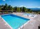 Large community pool area with mountain views and plenty of seating at 24172 Jerome Ct, Golden, CO 80401