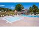 Community pools with ample lounging space and a nearby playground at 24172 Jerome Ct, Golden, CO 80401