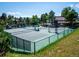 Well-maintained tennis courts surrounded by lush greenery and a clubhouse at 24172 Jerome Ct, Golden, CO 80401