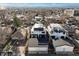 Neighborhood aerial view showcasing the modern home with solar panels and rooftop deck at 2248 S Lincoln St, Denver, CO 80210
