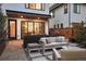 Backyard patio area with comfortable seating and manicured landscaping at 2248 S Lincoln St, Denver, CO 80210