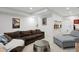 Finished basement boasting a sprawling lounge area with plush sofas and a sleek coffee table for comfortable gatherings at 2248 S Lincoln St, Denver, CO 80210