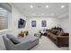 Finished basement featuring a comfortable seating area, piano and modern decor at 2248 S Lincoln St, Denver, CO 80210