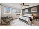Stylish bedroom with large windows, modern decor, and a comfortable seating area at 2248 S Lincoln St, Denver, CO 80210