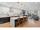 Modern kitchen featuring an island with bar seating, white cabinets, and stainless steel appliances at 2248 S Lincoln St, Denver, CO 80210