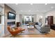 Open-concept living room with a fireplace, hardwood floors, and sliding glass doors to an outdoor patio at 2248 S Lincoln St, Denver, CO 80210
