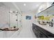 Main bathroom featuring double vanity sinks, and a stand alone glass shower at 2248 S Lincoln St, Denver, CO 80210