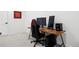 Home office setup with gaming chair, desk, and computer equipment at 2248 S Lincoln St, Denver, CO 80210