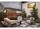 Cozy patio with modern outdoor seating and decorative trees, perfect for relaxing or entertaining at 2248 S Lincoln St, Denver, CO 80210