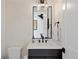 Stylish powder room with marble wallpaper, contemporary fixtures, and a floating vanity at 2248 S Lincoln St, Denver, CO 80210