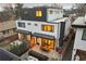 A modern home showcases a spacious patio with outdoor seating and a BBQ grill at 2248 S Lincoln St, Denver, CO 80210