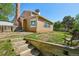 Beautifully landscaped backyard with a retaining wall and stair access to an upper level at 3285 W 11Th Avenue Ct, Broomfield, CO 80020