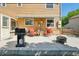 Backyard patio featuring a gas grill, seating, and fire pit perfect for outdoor entertaining at 3285 W 11Th Avenue Ct, Broomfield, CO 80020