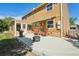 Backyard patio area with seating, grill, awning, and fire pit, perfect for outdoor enjoyment at 3285 W 11Th Avenue Ct, Broomfield, CO 80020