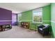 Bright bedroom with two-toned walls, carpet, and ample natural light from the windows at 3285 W 11Th Avenue Ct, Broomfield, CO 80020
