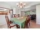 Formal dining room with wood floors and view to the kitchen area at 3285 W 11Th Avenue Ct, Broomfield, CO 80020