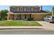 Charming two-story home with brick accents, a covered porch, and solar panels on the roof at 3285 W 11Th Avenue Ct, Broomfield, CO 80020