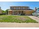 Charming two-story home with brick accents, a covered porch, and an attached two-car garage at 3285 W 11Th Avenue Ct, Broomfield, CO 80020