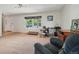 Inviting living room with a large window, perfect for a home office setup and relaxing at 3285 W 11Th Avenue Ct, Broomfield, CO 80020