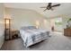 Bright main bedroom features carpeting, neutral walls, and access to the bathroom at 3285 W 11Th Avenue Ct, Broomfield, CO 80020