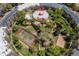 Overhead shot of a condo community with pool, gym, tennis court, volleyball court, ponds and green spaces at 1306 S Parker Rd # 162, Denver, CO 80231