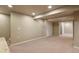 Finished basement includes neutral walls and flooring, recessed lighting, and access to storage at 3495 Amber Sun Cir, Castle Rock, CO 80108