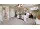 This cozy bedroom offers a ceiling fan and two end tables at 3495 Amber Sun Cir, Castle Rock, CO 80108