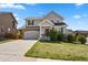 Charming two-story home with well-maintained lawn and a stone-accented garage at 3495 Amber Sun Cir, Castle Rock, CO 80108