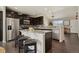 Spacious kitchen island with bar seating, stainless appliances, and granite countertops at 3495 Amber Sun Cir, Castle Rock, CO 80108