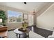 Cozy living room features hardwood floors, lots of light, and modern furnishings at 3495 Amber Sun Cir, Castle Rock, CO 80108
