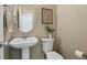Cozy powder room featuring a pedestal sink, and an oval mirror at 3495 Amber Sun Cir, Castle Rock, CO 80108