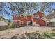 Exterior of the home showing a spacious backyard and a patio, perfect for outdoor activities at 17509 E Kenyon Dr, Aurora, CO 80013