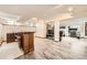 Finished basement area boasts modern flooring, a bar, and an open layout perfect for entertaining or relaxing at 17509 E Kenyon Dr, Aurora, CO 80013