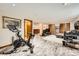 Spacious basement area with rec space and workout equipment, offering flexible living options at 17509 E Kenyon Dr, Aurora, CO 80013