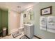 Cozy bathroom features a shower, modern vanity, mirror and new fixtures creating a functional space at 17509 E Kenyon Dr, Aurora, CO 80013