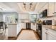 Bright kitchen featuring granite countertops, stainless steel appliances, and an overhead spotlight fixture at 17509 E Kenyon Dr, Aurora, CO 80013
