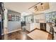 Open-concept kitchen and dining area with granite countertops and stainless steel appliances at 17509 E Kenyon Dr, Aurora, CO 80013