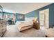 Comfortable main bedroom with a large bed, carpeted floors, and ensuite bathroom entrance, a tranquil retreat at 17509 E Kenyon Dr, Aurora, CO 80013