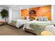 Spacious bedroom with a vibrant painted wall, two queen beds, and decorative pillows at 3275 W Hawthorne Pl, Denver, CO 80221