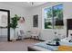 Cozy bedroom features a bright window and stylish furnishings, creating a peaceful retreat at 3275 W Hawthorne Pl, Denver, CO 80221