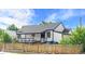 Charming home with a covered porch and a picket fence at 3275 W Hawthorne Pl, Denver, CO 80221