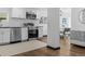 Modern kitchen with stainless steel appliances and hardwood flooring at 3275 W Hawthorne Pl, Denver, CO 80221