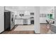 Contemporary kitchen featuring stainless steel appliances and sleek countertops at 3275 W Hawthorne Pl, Denver, CO 80221