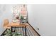 Bright and open office space with colorful wall art and a desk with painting supplies at 3275 W Hawthorne Pl, Denver, CO 80221