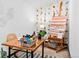 Home office with an easel, paint supplies, desk, chair, and bright floral wallpaper at 3275 W Hawthorne Pl, Denver, CO 80221