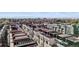 Aerial view showcases modern architecture with rooftop patios, colorful accents, and distant mountain views at 3040 Wilson Ct # 2, Denver, CO 80205