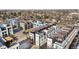 Modern townhomes with rooftop patios featuring pergolas in a neighborhood setting at 3040 Wilson Ct # 2, Denver, CO 80205